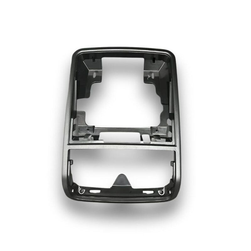 Cadre en plastique anthracite pour Boîte Lunettes Console Volkswagen Jetta 5, avec ouvertures pour modules et fixations internes.