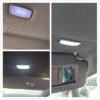 Éclairage plafonnier pare-soleil pour Golf 6 : module LED rectangulaire en plastique noir installé au ciel de toit.