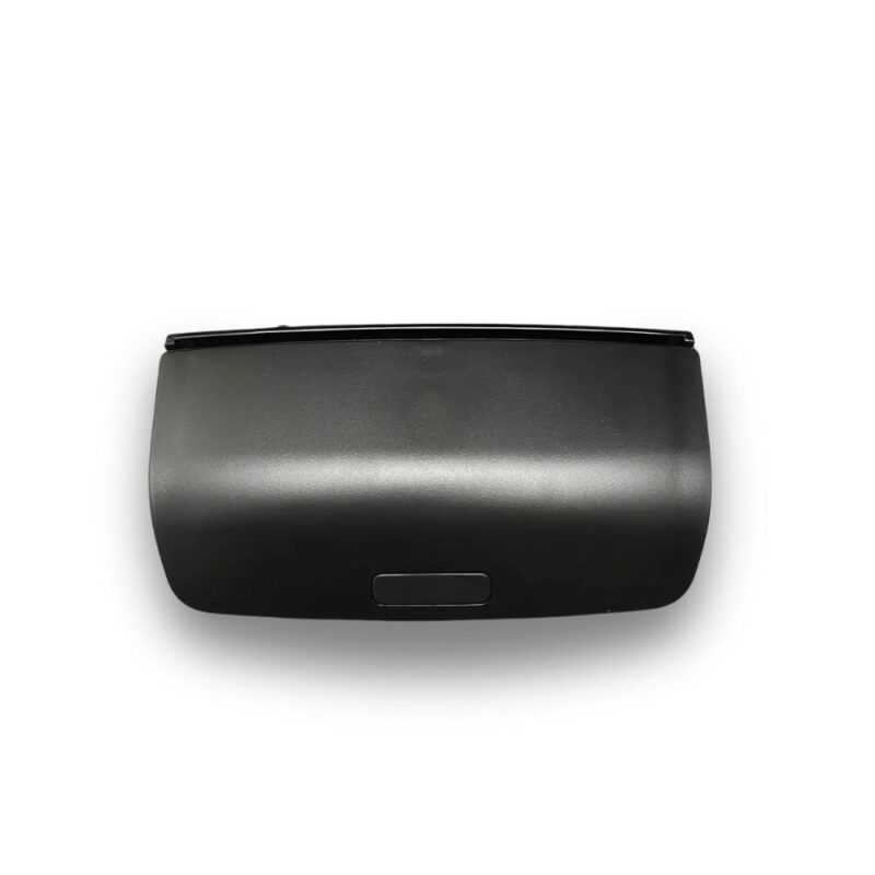 Boîte lunettes console Volkswagen Jetta 5 noire, en plastique mat, rectangulaire arrondie, avec loquet d'ouverture.