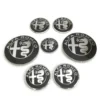 27c2d662-7026-47fc-9462-048c4717bcf7.webp Kit de 7 emblèmes Alfa Romeo noir et argent, vue de dessus